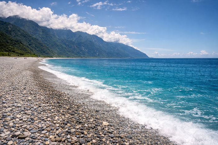 Qixingtan Beach pebble shoreline with Pacific Ocean near Hualien Taiwan